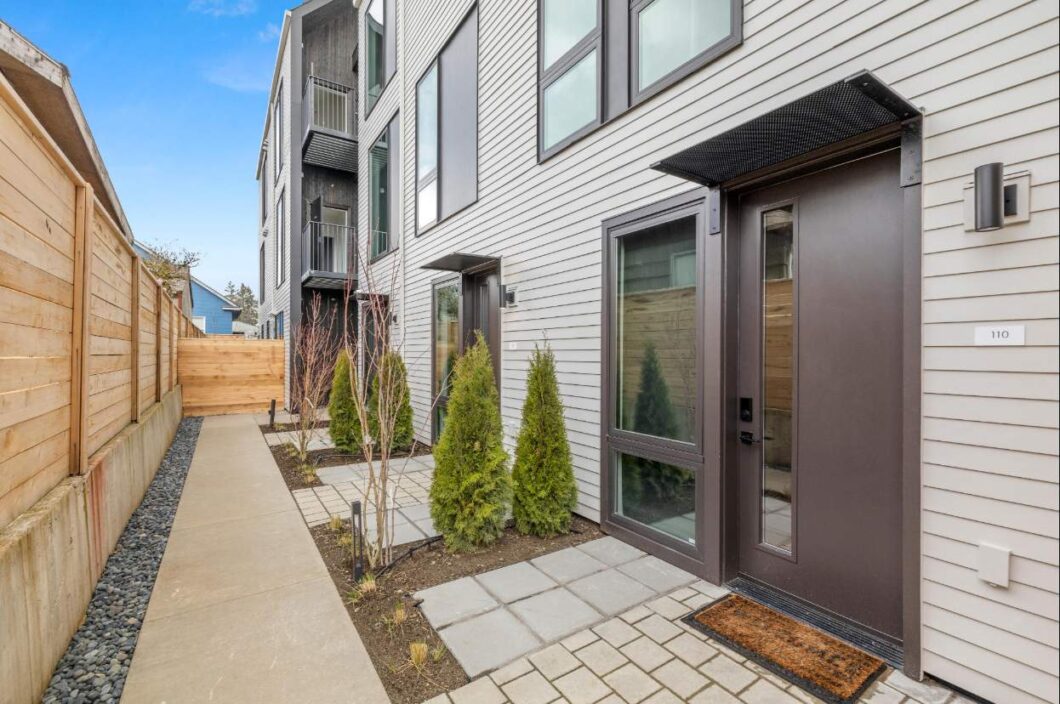 Modern townhouse entrance with landscaped path. 1615 N Willis Blvd #110, Portland, OR 97217. Spaces for rent by NWV Group.