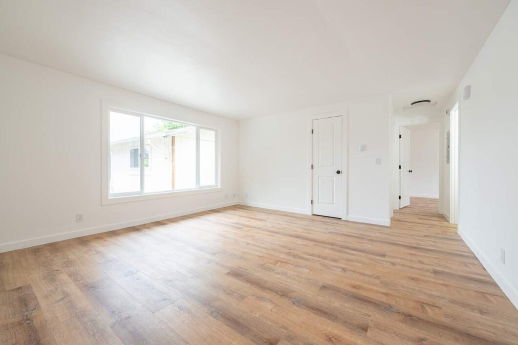 Spacious living room with wood floors at 284 S Knott St, Canby, OR. For rent by NWV Group.