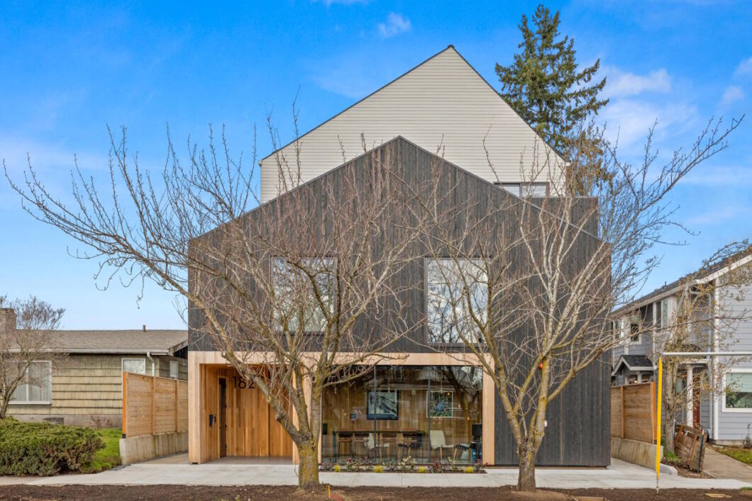 Modern building exterior with large glass windows and landscaping. 1615 Wills Blvd #340, Portland, OR 97217. Spaces for rent by NWV Group.