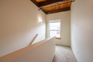 Bedroom with ceiling fan, mirrored closet, and neutral decor. 2808 NE MLK Blvd APT 26, Portland, OR 97212. Spaces for rent by NWV Group.