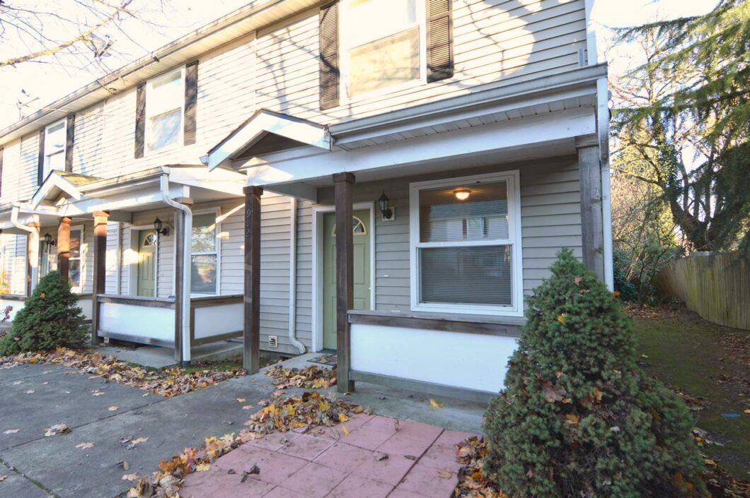 Front of townhome with porch and shrubs. 4616 NE Irving St #4614, Portland, OR 97213. Spaces for rent by NWV Group.