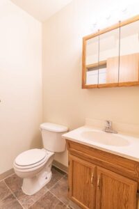 Bathroom with sink, toilet, and mirror. 4616 NE Irving St #4614, Portland, OR 97213. Spaces for rent by NWV Group.