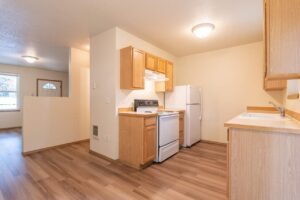 Kitchen with stove and refrigerator. 4616 NE Irving St #4614, Portland, OR 97213. Spaces for rent by NWV Group.