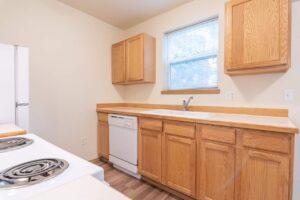 Kitchen with sink, dishwasher, and cabinets. 4616 NE Irving St #4614, Portland, OR 97213. Spaces for rent by NWV Group.