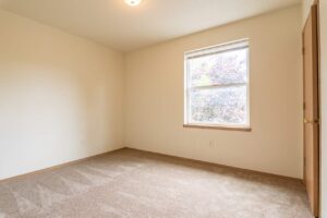 Bedroom with window and natural light. 4616 NE Irving St #4614, Portland, OR 97213. Spaces for rent by NWV Group.