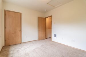 Bedroom with closet and hallway view. 4616 NE Irving St #4614, Portland, OR 97213. Spaces for rent by NWV Group.