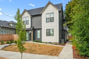 Modern two-story home with dark and white siding. 6417 N Greeley Ave #4, Portland, OR 97217. Spaces for rent by NWV Group.