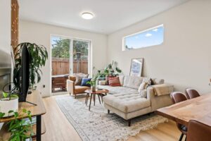 Open living space with greenery, natural light, and modern decor. 6417 N Greeley Ave #4, Portland, OR 97217. Spaces for rent by NWV Group.