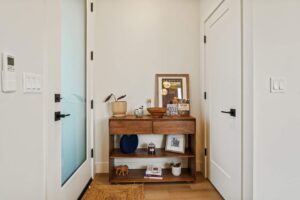 Entryway with modern wooden console and decorative items. 6417 N Greeley Ave #4, Portland, OR 97217. Spaces for rent by NWV Group.