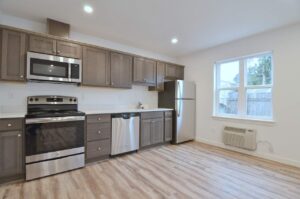 Kitchen with gray cabinets and ample counter space. 9572 N Calhoun Ave UNIT B, Portland, OR 97203. Spaces for rent by NWV Group.