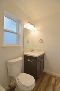 Bathroom with modern vanity and mirror. 9572 N Calhoun Ave UNIT B, Portland, OR 97203. Spaces for rent by NWV Group.