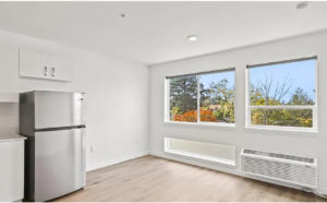 Bright living area with large windows and sleek design. Spaces for rent by NWV Group. 125 NE Shaver St #B, Portland, OR 97212.