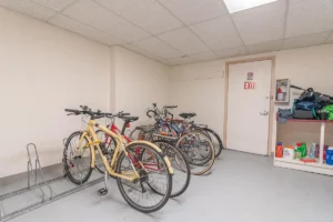 Indoor bike storage room with racks for multiple bikes. Spaces for rent by NWV Group. 1210 SE 20th Ave APT 103, Portland, OR 97214.