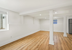 Large basement room with hardwood flooring and natural light. Spaces for rent by NWV Group. 125 NE Shaver St #B, Portland, OR 97212.