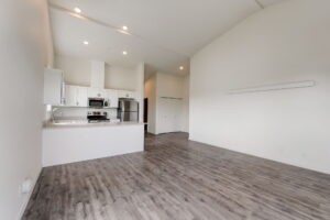 Spacious kitchen with white cabinets, stainless steel appliances, and a large countertop. Spaces for rent by NWV Group at 4712 N Williams Ave #204.