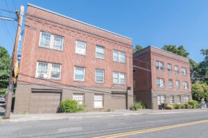 Another exterior angle of the apartment building facade. Spaces for rent by NWV Group. 1210 SE 20th Ave APT 103, Portland, OR 97214.