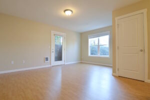 Living room with door to the outside and window. Spaces for rent by NWV Group at 6928 N Greenwich Ave APT 2.