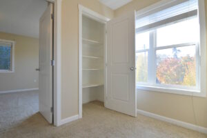 Open closet with built-in shelving next to a large window. Spaces for rent by NWV Group at 6928 N Greenwich Ave APT 2.