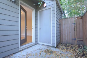 Outdoor entry area with a concrete floor and storage door. Spaces for rent by NWV Group at 6928 N Greenwich Ave APT 2.