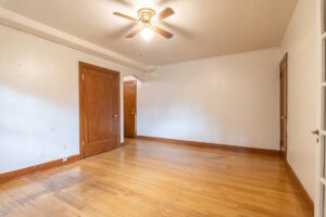 Living room showing hallway and wood-paneled doors. Spaces for rent by NWV Group. 1210 SE 20th Ave APT 103, Portland, OR 97214.