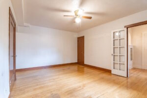 Bright living room with French door leading to another area. Spaces for rent by NWV Group. 1210 SE 20th Ave APT 103, Portland, OR 97214.