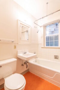 Bathroom with bathtub, sink, and natural light. Spaces for rent by NWV Group. 1210 SE 20th Ave APT 103, Portland, OR 97214.