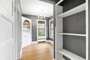 Elegant dining area with dark gray walls and chandelier. 2233 NW Flanders St APT 9, Portland, OR 97210. Spaces for rent by NWV Group.