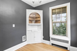 Built-in white cabinetry with glass doors in a cozy nook. 2233 NW Flanders St APT 9, Portland, OR 97210. Spaces for rent by NWV Group.