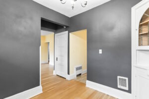 View from dining area into adjacent rooms with hardwood floors. 2233 NW Flanders St APT 9, Portland, OR 97210. Spaces for rent by NWV Group.