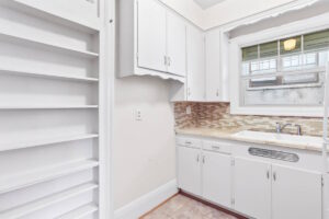 Bright kitchen with mosaic backsplash and double sink. 2233 NW Flanders St APT 9, Portland, OR 97210. Spaces for rent by NWV Group.