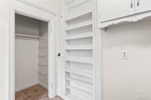 Close-up of pantry shelving with decorative quote above. 2233 NW Flanders St APT 9, Portland, OR 97210. Spaces for rent by NWV Group.