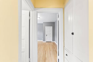 Hallway with built-in storage leading to a bright room. 2233 NW Flanders St APT 9, Portland, OR 97210. Spaces for rent by NWV Group.