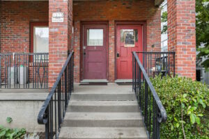 Entrance with two red brick steps leading to separate doors. 2233 NW Flanders St APT 9, Portland, OR 97210. Spaces for rent by NWV Group.